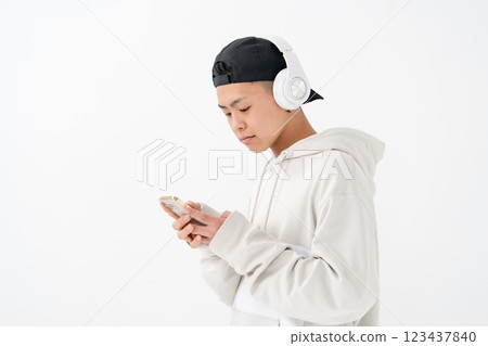 Male teenager portrait headphones smartphone Male teenager portrait headphones smartphone 123437840