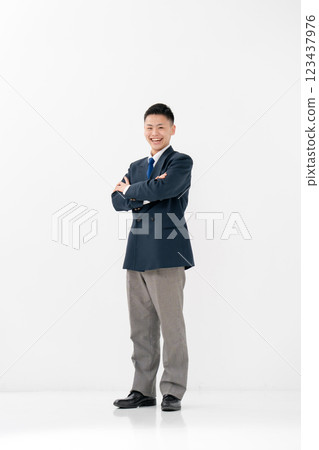 Male high school student uniform arms crossed 123437976