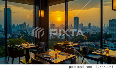 A dining room with a view of the city at sunset A dining room with a view of the city at sunset 123439061