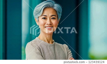 A woman with blue hair smiling at the camera A woman with blue hair smiling at the camera 123439124