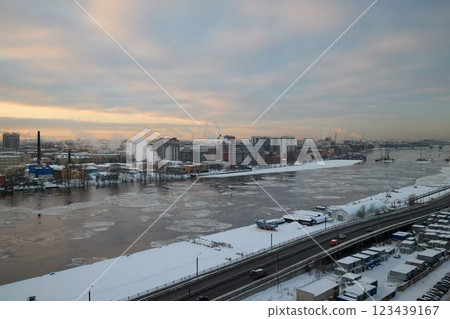 A winter scene with a snowy river landscape, harmoniously blending industrial elements A winter scene with a snowy river landscape, harmoniously blending industrial elements 123439167