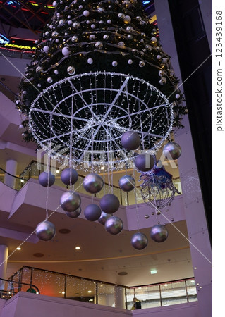 Experience the vibrant holiday decorations in the modern mall that enhance the seasons joy 123439168