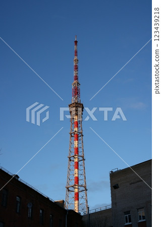 A Broadcast Tower Stands Tall Against a Bright Clear Blue Sky, Symbolizing Modern Communication 123439218