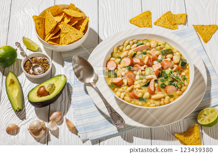white bean chickpea chili with sausages, zucchini 123439380