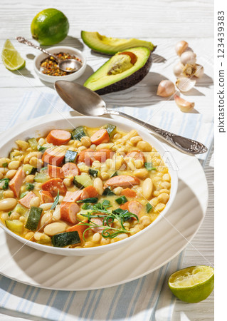 white bean chickpea chili with sausages, zucchini 123439383
