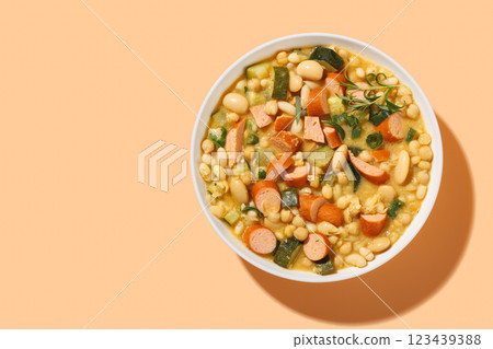 white bean chickpea chili with sausages, zucchini white bean chickpea chili with sausages, zucchini 123439388