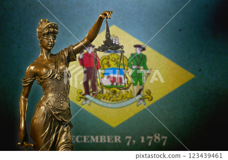 Lady Justice before a flag of Delaware 123439461