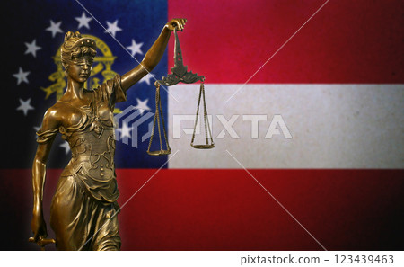 Lady Justice before a flag of the state of Georgia 123439463