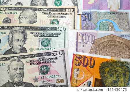 Stack of US Dollars and Macedonian denar 123439473