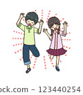 Smiling boy and girl jumping with their hands up 123440254