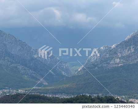 Mountain landscape in cloudy weather. Haze in the mountains. Two mountains opposite each other 123440340