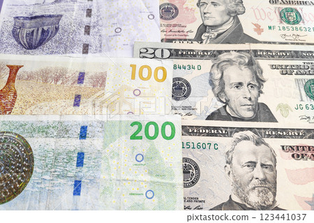 Stack of Danish Kroner and US Dollar 123441037