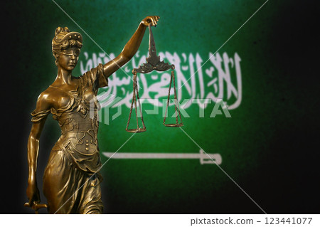 Lady Justice before a flag of Saudi Arabia 123441077
