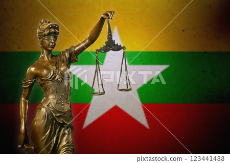 Lady Justice before a flag of Myanmar Lady Justice before a flag of Myanmar 123441488