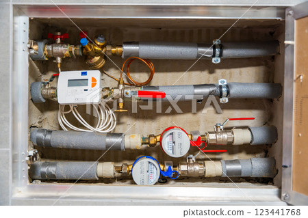 Smart water and heat meters with remote data transmission installed in a European utility system. The concept represents modern energy efficiency and digital infrastructure development 123441768