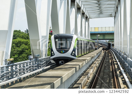 A Green Line train running on the elevated track of the Taichung Rapid Transit System in Taiwan.  123442592