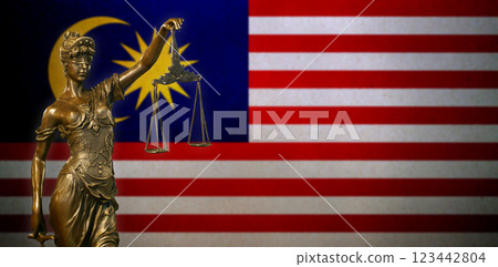 Lady Justice before a flag of Malaysia 123442804