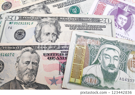Stack of US Dollar and Mongolian Togrog Stack of US Dollar and Mongolian Togrog 123442836