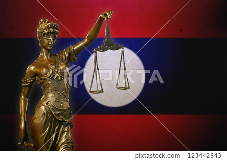 Lady Justice before a flag of Laos Lady Justice before a flag of Laos 123442843