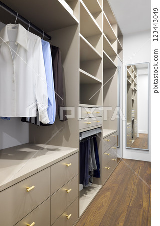 A Stylish and Modern Closet that Features Organized Storage Solutions for Your Needs 123443049