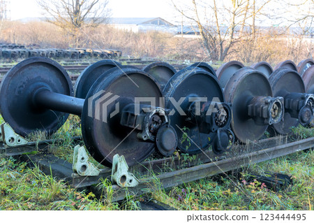 Old train wheelsets sit abandoned awaiting inspection is under restoration on transportation maintenance railway yard 123444495