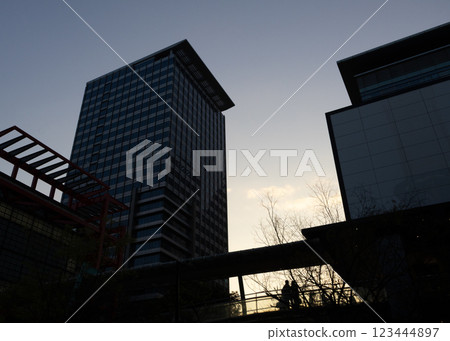 A perspective looking up at a skyscraper at dusk A perspective looking up at a skyscraper at dusk 123444897