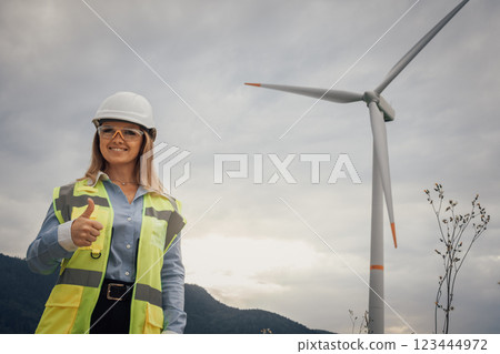 Empowered Woman in Renewable Energy A showcase of a wind turbine project highlighting the impactful role of women in engineering and sustainability in the renewable energy sector Empowered Woman in Renewable Energy A showcase of a wind turbine project highlighting the impactful role of women in engineering and sustainability in the renewable energy sector 123444972