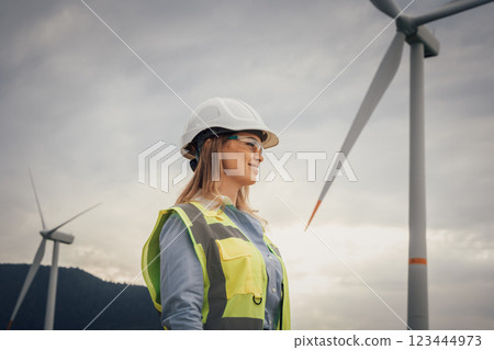 A Female Engineer working at a Wind Energy Facility is making significant strides in empowering innovative renewable energy solutions, contributing to a more sustainable and ecofriendly future A Female Engineer working at a Wind Energy Facility is making significant strides in empowering innovative renewable energy solutions, contributing to a more sustainable and ecofriendly future 123444973