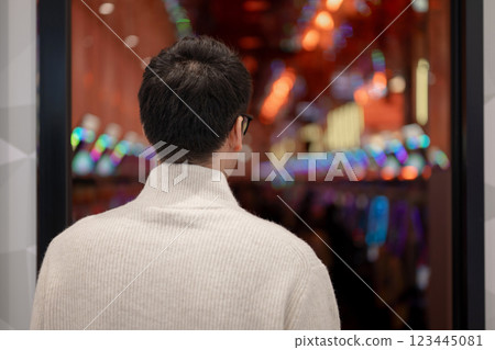 A man entering a pachinko parlor A man entering a pachinko parlor 123445081