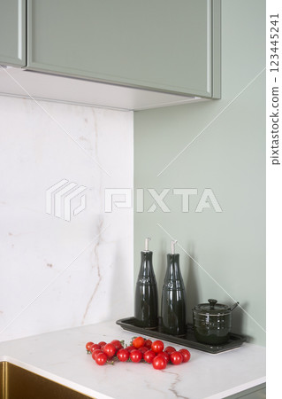 This modern kitchen corner showcases stylish decor and features fresh cherry tomatoes 123445241