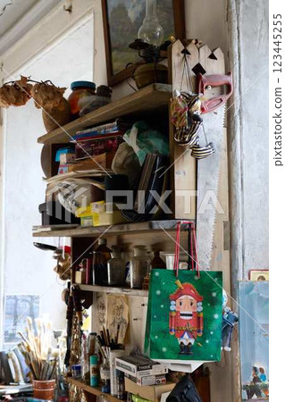 Eclectic Home Studio Shelves Filled with Imaginative Creative Supplies and Artistic Tools Eclectic Home Studio Shelves Filled with Imaginative Creative Supplies and Artistic Tools 123445255