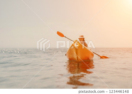 Kayak sea woman. Happy attractive woman with long hair in red swimsuit, swimming on kayak. Summer holiday vacation and travel concept. 123446148