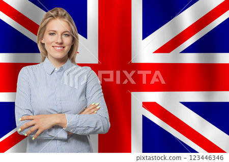 Pretty happy woman with flag of UK 123446346