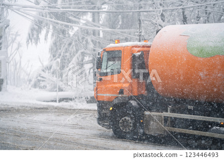 Garbage truck on a snowy winter street Garbage truck on a snowy winter street 123446493