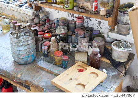 An Artists Imaginative Creative Workspace, Complete with Various Paints and Paint Brushes An Artists Imaginative Creative Workspace, Complete with Various Paints and Paint Brushes 123447007