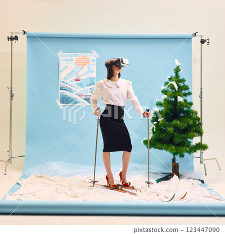 Confident woman in business attire wearing VR headset standing on skis against abstract winter background. Confident woman in business attire wearing VR headset standing on skis against abstract winter background. 123447090