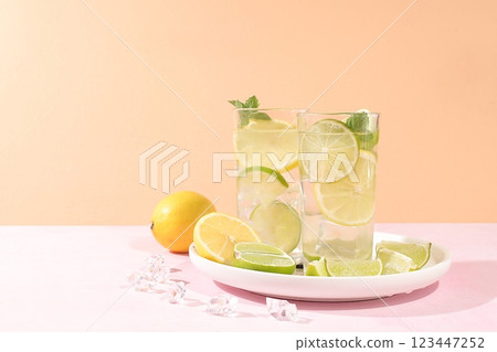 Detox drink with lemon, mint, lime and orange on a light table, majito or cocktail improves metabolism and promotes weight loss, healthy lifestyle concept, selective focus 123447252