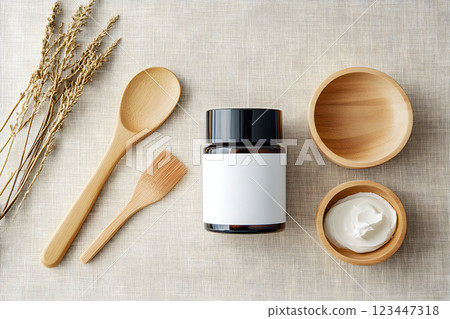 Natural skin therapy cosmetic jar on a neutral fabric background with utensils for aromatherapy and organic extracts 123447318
