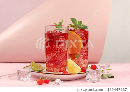 Refreshing summer homemade lemonade cocktail, mojito with raspberries, currants, mint and lemon, fruit flavored detox water, weight loss concept, healthy and natural food, selective focus Refreshing summer homemade lemonade cocktail, mojito with raspberries, currants, mint and lemon, fruit flavored detox water, weight loss concept, healthy and natural food, selective focus 123447367