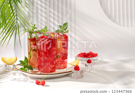 Refreshing summer homemade lemonade cocktail, mojito with raspberries, currants, mint and lemon, fruit flavored detox water, weight loss concept, healthy and natural food, selective focus Refreshing summer homemade lemonade cocktail, mojito with raspberries, currants, mint and lemon, fruit flavored detox water, weight loss concept, healthy and natural food, selective focus 123447368