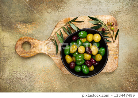 a mixture of olives, varieties of chalkidiki, Verdi giganti and Kalamata, in a bowl, top view, no people, a mixture of olives, varieties of chalkidiki, Verdi giganti and Kalamata, in a bowl, top view, no people, 123447499
