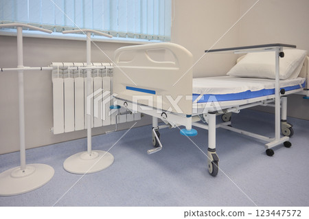A Hospital Bed located within a Medical Facility designed for patient comfort and care 123447572