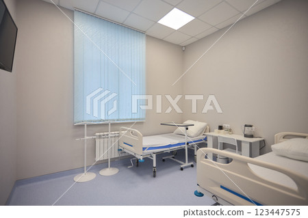 A Hospital Bed located within a Medical Facility designed for patient comfort and care 123447575