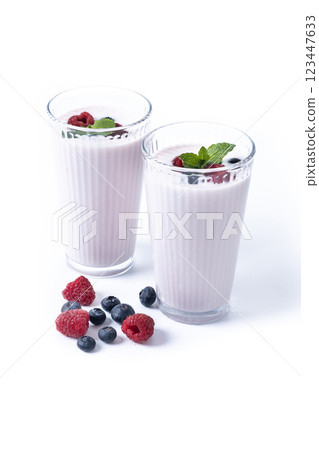 Fresh raspberry and blueberry smoothie isolated on white background 123447633
