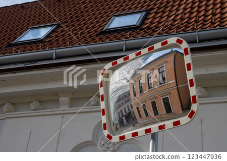 Orange classic building in a traffic mirror, Czechia Orange classic building in a traffic mirror, Czechia 123447936