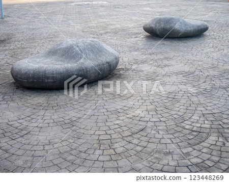 Benches from stones. Unusual design of benches in the park. Smooth big stones. Benches from stones. Unusual design of benches in the park. Smooth big stones. 123448269
