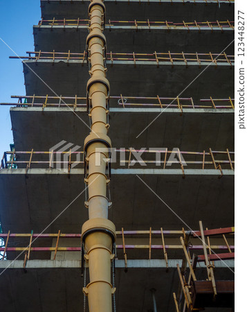 Sleeve for dumping debris at a construction site  Down up. View from below. Frame of a concrete structure. 123448277