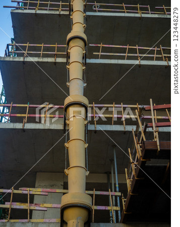 Sleeve for dumping debris at a construction site  Down up. View from below. Frame of a concrete structure. 123448279