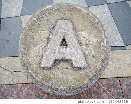 Letter A made of stone. Carved letter A in concrete. Alphafit cast from concrete. The concept of the letter A. Letter A made of stone. Carved letter A in concrete. Alphafit cast from concrete. The concept of the letter A. 123448386