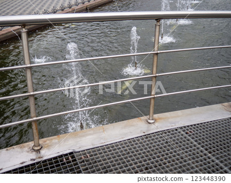 Fountain jets. In gray tones. Fountain in the park. Fountain jets. In gray tones. Fountain in the park. 123448390